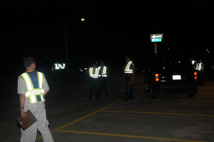 Police officers standing and talking to one another.