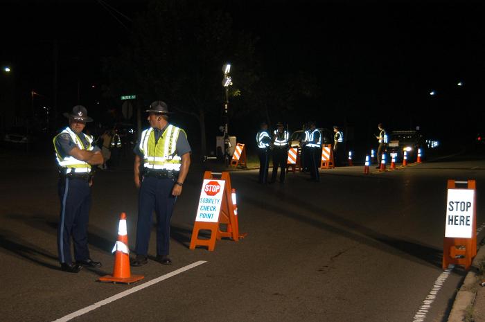 Police officers standing around talking to each other.