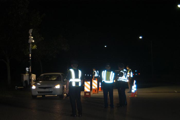 Police officers conducting a traffic stop.