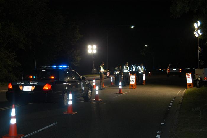 Police officers conducting a traffic stop.