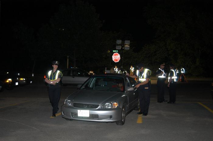 Police officers conducting a traffic stop.