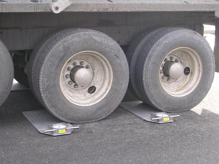 Truck Tires Being Measured