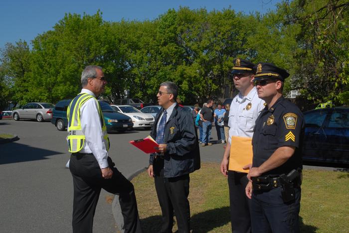 Police officers standing together talking.