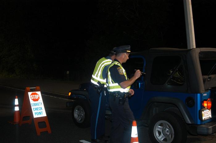 Police officers stopping a vehicle.