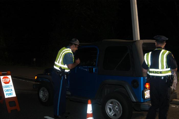 Police officers stopping a vehicle.